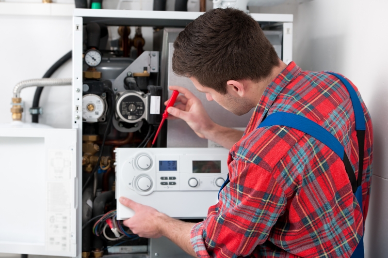 Gas Safe engineer working on a boiler in Swiss Cottage